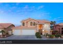 Charming two-story home boasting a three-car garage and inviting curb appeal at 3950 Candleglow Ct, Las Vegas, NV 89147