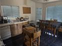 Functional kitchen space with wood cabinets and an adjacent dining area at 4607 Chestnut Blaze Dr, North Las Vegas, NV 89032