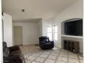 Comfortable living room showcasing neutral paint, recessed entertainment center, and a plush area rug at 4607 Chestnut Blaze Dr, North Las Vegas, NV 89032