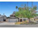 Charming two-story home features a well-maintained lawn and a classic architectural design at 5019 Lancaster Dr, Las Vegas, NV 89120
