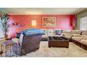 Comfortable living room with a large sofa, accent chair, and stylish furnishings for relaxation at 5019 Lancaster Dr, Las Vegas, NV 89120