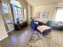 Inviting living room boasting a vaulted ceiling, large windows, and stylish decor at 5381 Waving Sage Dr, Las Vegas, NV 89149