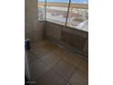 Enjoy outdoor living on this cozy patio with neutral tile floors, perfect for relaxing or entertaining guests at 5710 E Tropicana Ave # 1053, Las Vegas, NV 89122