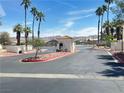 Secured community gate with desert landscaping and a picturesque mountain backdrop at 698 S Racetrack Rd # 322, Henderson, NV 89015