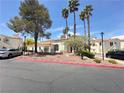 Beautiful exterior showcasing well-maintained buildings, mature trees, and manicured landscaping at 698 S Racetrack Rd # 322, Henderson, NV 89015