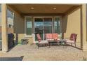 Outdoor patio space features a comfortable seating arrangement, perfect for relaxing and enjoying the outdoors at 7175 Steubling Glen St, North Las Vegas, NV 89084