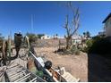 Messy backyard full of debris that needs landscaping at 7300 Mountain Moss Dr, Las Vegas, NV 89147