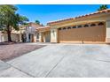 Spacious driveway leading to a two-car garage of this single-story home at 8504 W Gilmore Ave, Las Vegas, NV 89129