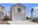 Charming home with a two-car garage and stucco exterior, with palm trees dotting the neighborhood at 9290 S Cool Creek Ave, Las Vegas, NV 89147
