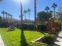 Landscaped community green space with picnic tables and shade trees at 1050 E Cactus Ave # 2110, Las Vegas, NV 89183