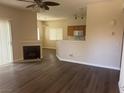 Open-concept living area featuring a fireplace and seamlessly connected kitchen space at 1050 E Cactus Ave # 2110, Las Vegas, NV 89183