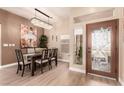 Dining room featuring hardwood floors and elegant chandelier at 10713 Shoalhaven Dr, Las Vegas, NV 89134