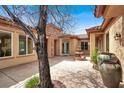 Relaxing courtyard showcasing a stone fountain, lush greenery and stylish architectural details at 2318 Shorewood Hills Ave, Henderson, NV 89052