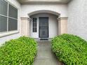 Close-up of the front entrance, showcasing the secure screen door at 2557 Terrytown Ave, Henderson, NV 89052