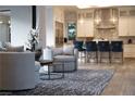 Cozy living space adjacent to the kitchen, complete with comfortable seating and stylish decor at 5 Moonfire Dr, Las Vegas, NV 89135