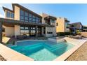 Backyard featuring a modern pool, hot tub, patio, and mountain views at 5436 Succulent Rose Dr, Las Vegas, NV 89135