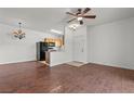 Bright living area with wood flooring and ceiling fan opens to the kitchen at 5655 E Sahara Ave # 2044, Las Vegas, NV 89142