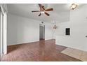 Open living room features wood floors, ceiling fan, and bright natural light at 5655 E Sahara Ave # 2044, Las Vegas, NV 89142