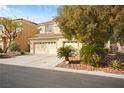 Attractive home with a three-car garage and easy-care desert landscaping at 5832 Ivy Vine Ct, Las Vegas, NV 89141