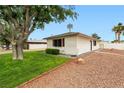A quaint single-story home showcasing a well-maintained lawn at 5921 Halifax Ave, Las Vegas, NV 89107