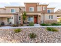 Inviting townhome featuring an attractive rock front yard at 6150 Foxes Dale St, Las Vegas, NV 89166