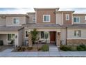 Charming townhome featuring desert landscaping and a cozy front porch at 6150 Foxes Dale St, Las Vegas, NV 89166
