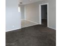 A living room shows carpeted flooring, and a doorway to another room at 621 Van Ert Ave, North Las Vegas, NV 89030