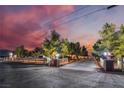 Long driveway leads to a beautiful estate behind a white fence, promising privacy and a grand entrance at 6931 Leon Ave, Las Vegas, NV 89131