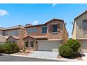 Lovely two-story home with a terracotta roof, two-car garage, and neutral stucco exterior at 8059 Wards Ferry St, Las Vegas, NV 89139