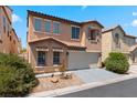 Charming two-story home featuring a terracotta roof, two-car garage and neutral stucco exterior at 8059 Wards Ferry St, Las Vegas, NV 89139