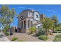 Stunning two-story home with desert landscaping, side patio, and plenty of curb appeal at 96 Campbelltown Ave, Henderson, NV 89015