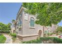 Corner townhome featuring low maintenance landscaping, walkway, and stucco exterior at 10001 Peace Way # 2335, Las Vegas, NV 89147