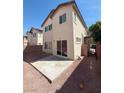 A compact backyard with low maintenance rock features a concrete patio at 1030 Maple Pines Ave, North Las Vegas, NV 89081
