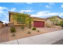 Single story home featuring a red tile roof, a brick driveway, and desert landscaping in the front yard at 10943 Artisan Ranch Ave, Las Vegas, NV 89166