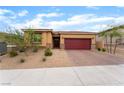 Single story home featuring a red tile roof, a brick driveway, and desert landscaping in the front yard at 10943 Artisan Ranch Ave, Las Vegas, NV 89166
