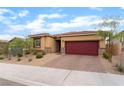Single story home featuring a red tile roof, a brick driveway, and desert landscaping in the front yard at 10943 Artisan Ranch Ave, Las Vegas, NV 89166