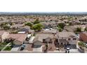 Aerial view of a single-story home, nestled in a quiet neighborhood with nearby mountain views at 1117 Azure Heights Pl, Las Vegas, NV 89110