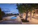 Beautiful backyard pool and patio area, perfect for entertaining or relaxing at 1413 Iron Hills Ln, Las Vegas, NV 89134