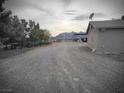 Expansive gravel yard, complemented by views of the surrounding landscape at 1930 N Murphy St, Pahrump, NV 89060