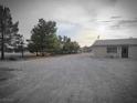Home exterior featuring a gravel yard and views of distant mountains at 1930 N Murphy St, Pahrump, NV 89060
