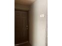 Close up of a dark wood entrance door with unit number 2113 on wall at 2200 S Fort Apache Rd # 2113, Las Vegas, NV 89117