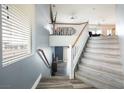 View of a staircase leading to the second level of the home with a landing and railing at 2208 Dale Bumpers Ct, North Las Vegas, NV 89081