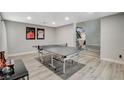 Bright game room featuring a ping pong table and stylish wood flooring is perfect for entertainment at 2224 Lucerne Ct, Henderson, NV 89014