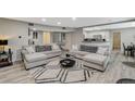 Open-concept living room with modern sofas and stylish decor, perfect for relaxing and entertaining at 2224 Lucerne Ct, Henderson, NV 89014