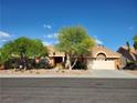 Charming single-story home featuring a well-maintained landscape and inviting curb appeal with a two car garage at 2540 Faiss Dr, Las Vegas, NV 89134