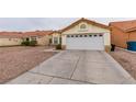 Charming single-story home with a two-car garage and concrete driveway at 2595 Fort Lauderdale Dr, Las Vegas, NV 89156