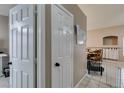 A bright hallway featuring tiled floors that leads to the living and dining areas at 2595 Fort Lauderdale Dr, Las Vegas, NV 89156