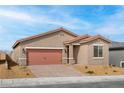 Charming single-story home showcasing a desert-landscaped front yard, brick driveway, and an attached two-car garage at 2727 Avril Point St, Las Vegas, NV 89156