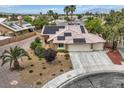 Inviting aerial view of a well-maintained home with desert landscaping and roof-mounted solar panels at 3619 Bixbee Ct, Las Vegas, NV 89129