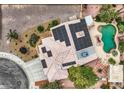 Aerial view of house featuring backyard pool, solar panels and landscaping at 3619 Bixbee Ct, Las Vegas, NV 89129
